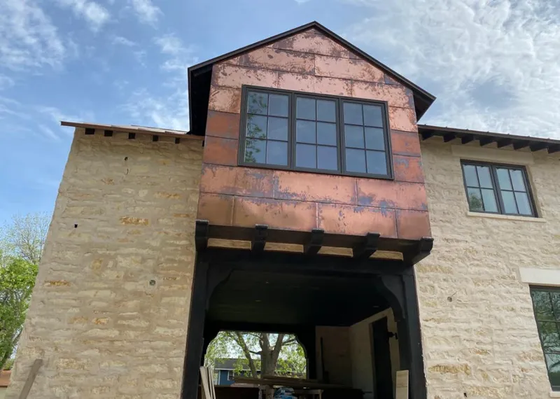 Copper metal panel facade on a stone building for Skylight Installation in Gardnerville Ranchos